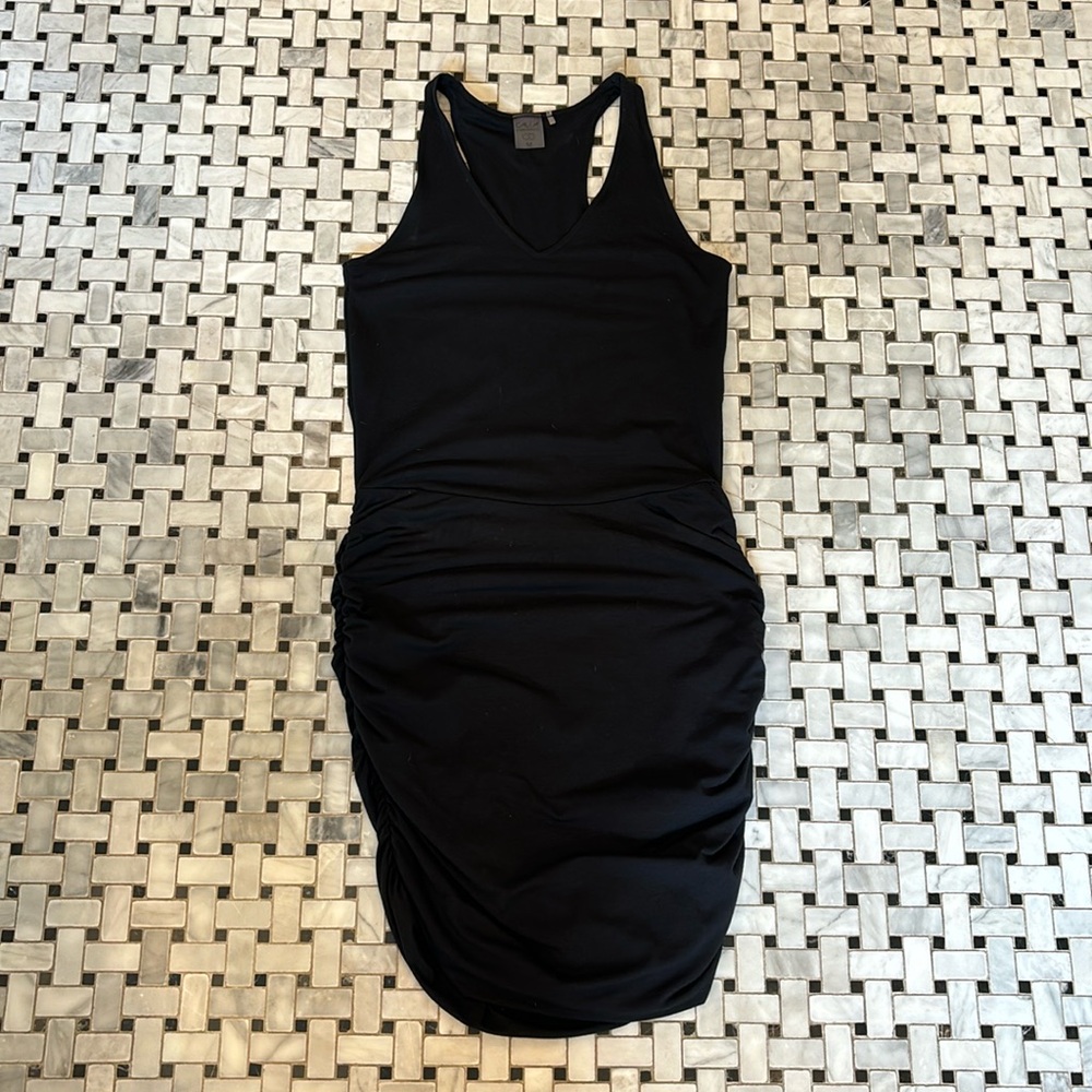 Black Calia mid length dress. Black. Size medium. Cinched sides.
